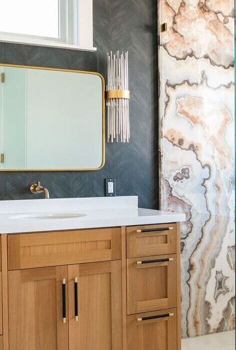 Chic bathroom remodeling with gold accents and patterned tiles