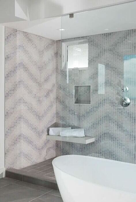 Classic bathroom renovation with timeless fixtures and mosaic tiles