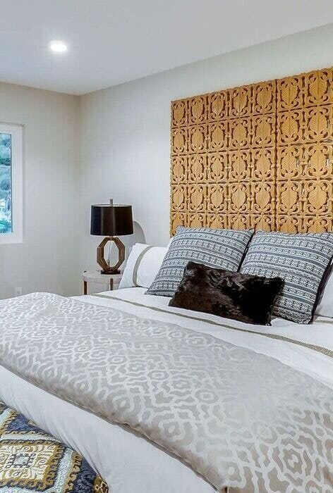 Chic bedroom remodel featuring a statement headboard and coordinated decor